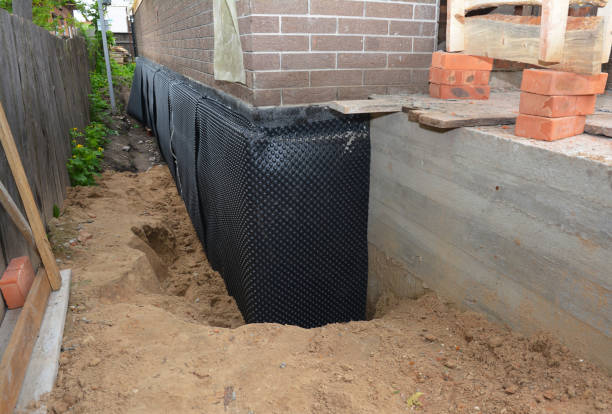 Happy homeowners after waterproofing job in Milford